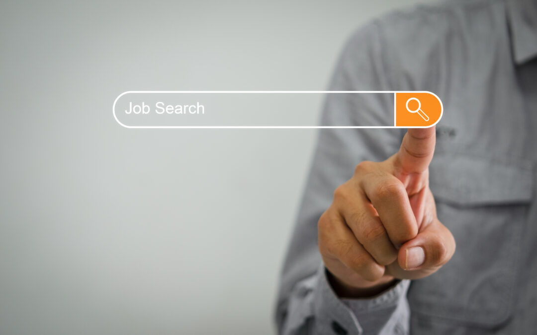 A person clicking the search button for a Job Search query